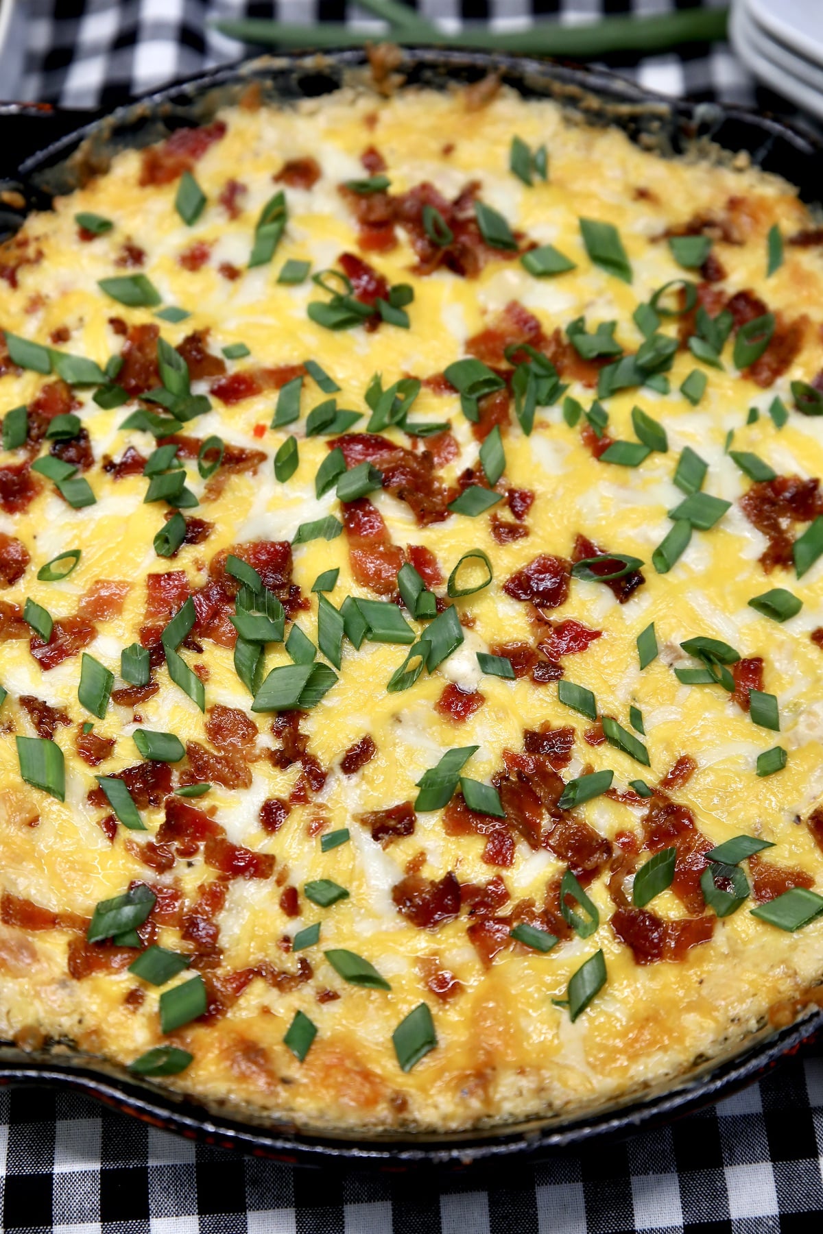 Mississippi Sin Dip in a skillet with bacon.