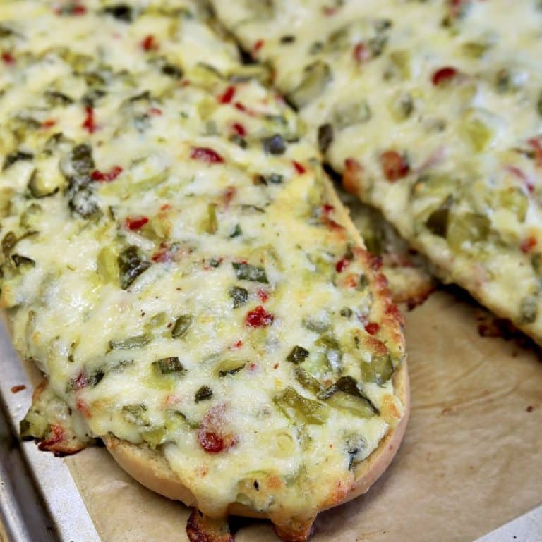 Toasted Cheesy Pickle Bread on a sheet pan.