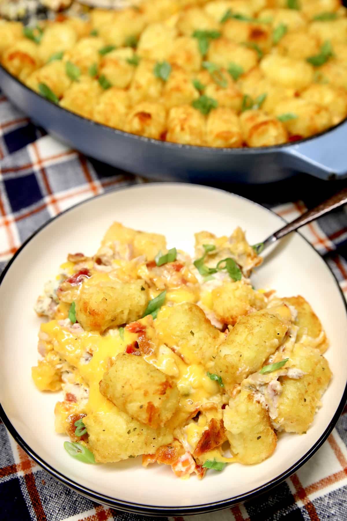 Chicken tater tot casserole with bacon on a plate.