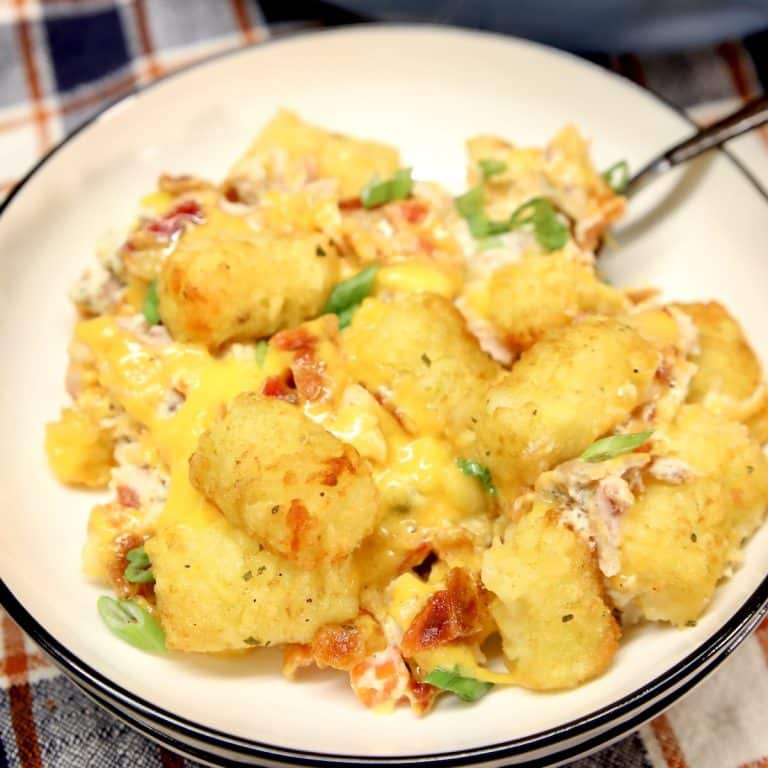 Tater tot casserole with chicken, bacon, ranch on a plate.