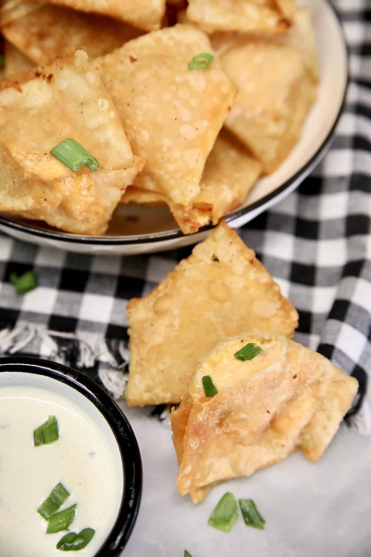 Buffalo chicken stuffed wontons appetizer. Fried wontons filled with buffalo chicken.