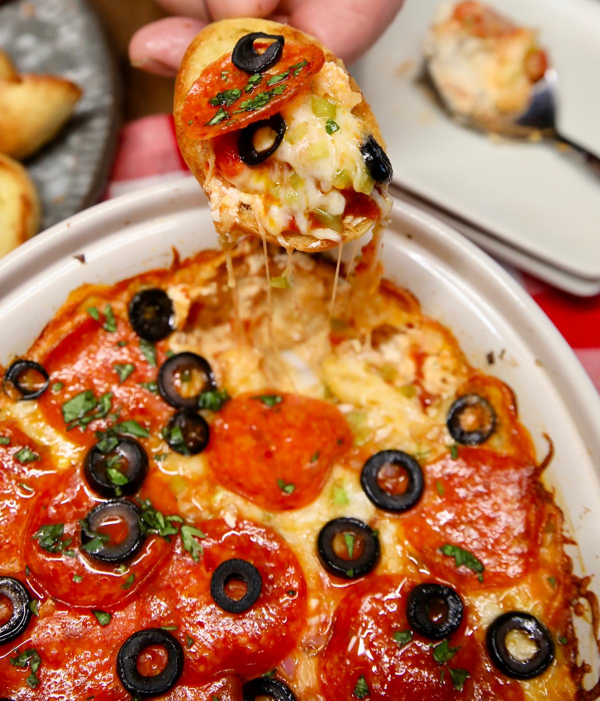 Pepperoni dip on a baguette.