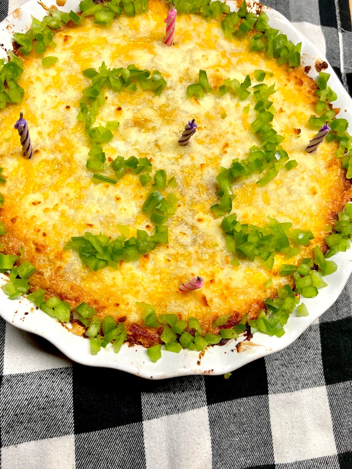 Bean dip with bell pepper garnish in the shape of 52.