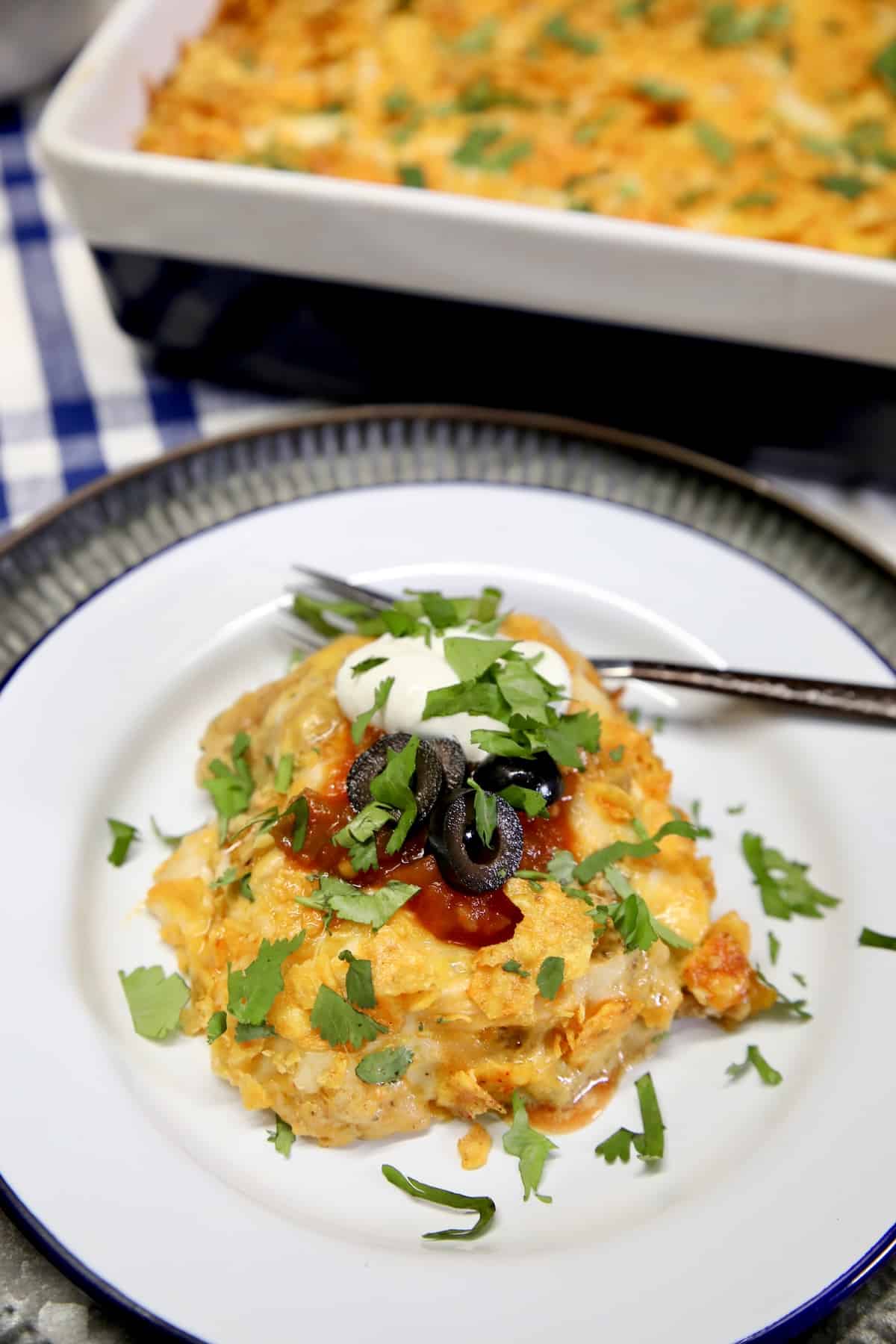 Chicken casserole on a plate with sour cream.