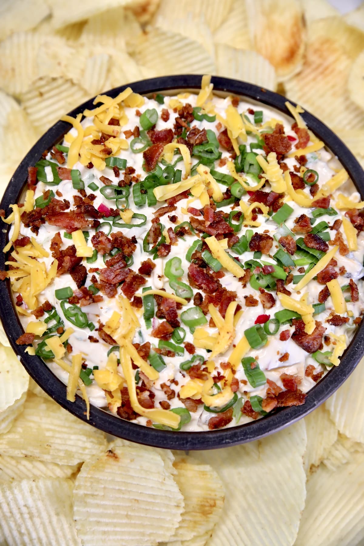 Bowl of dip with chips.