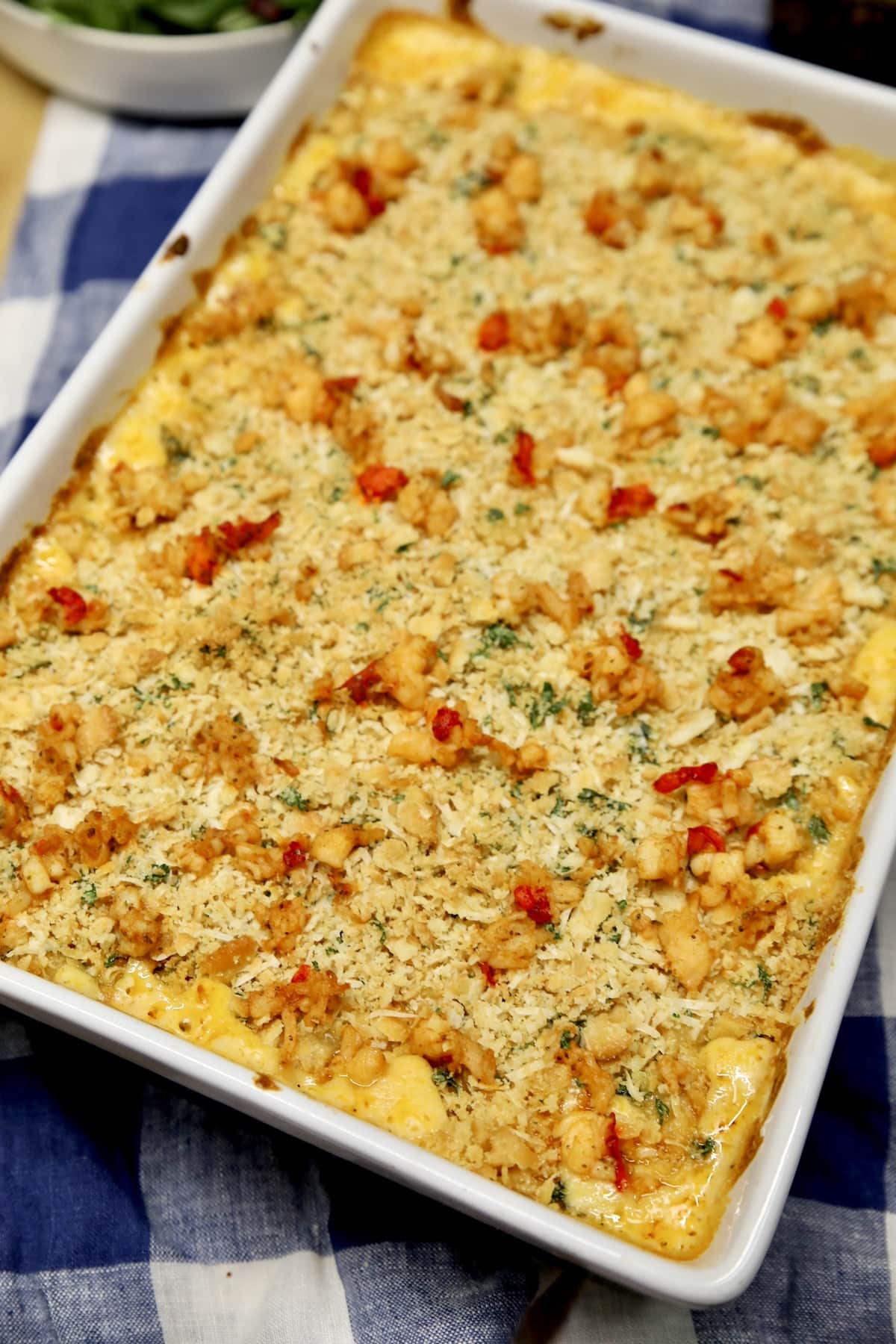 Casserole of mac and cheese with lobster bites.