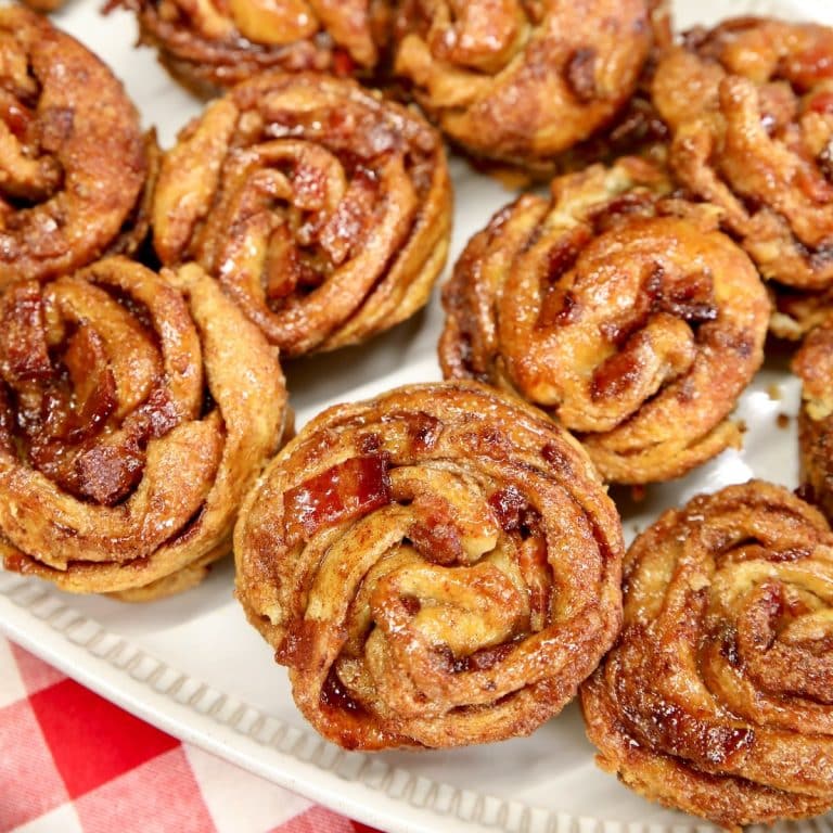 Bacon croissant muffins on a platter.