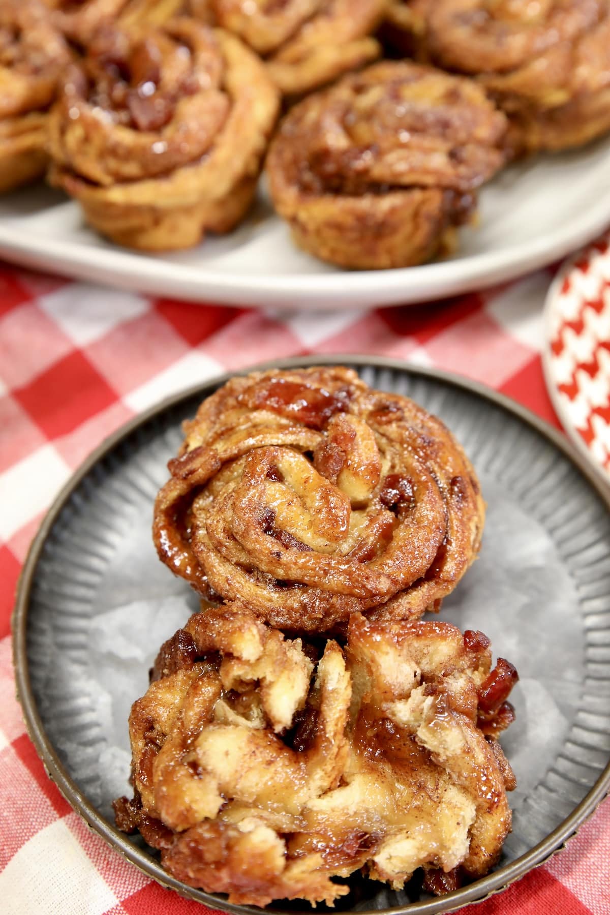 Plate with 2 cruffins, one torn in half.