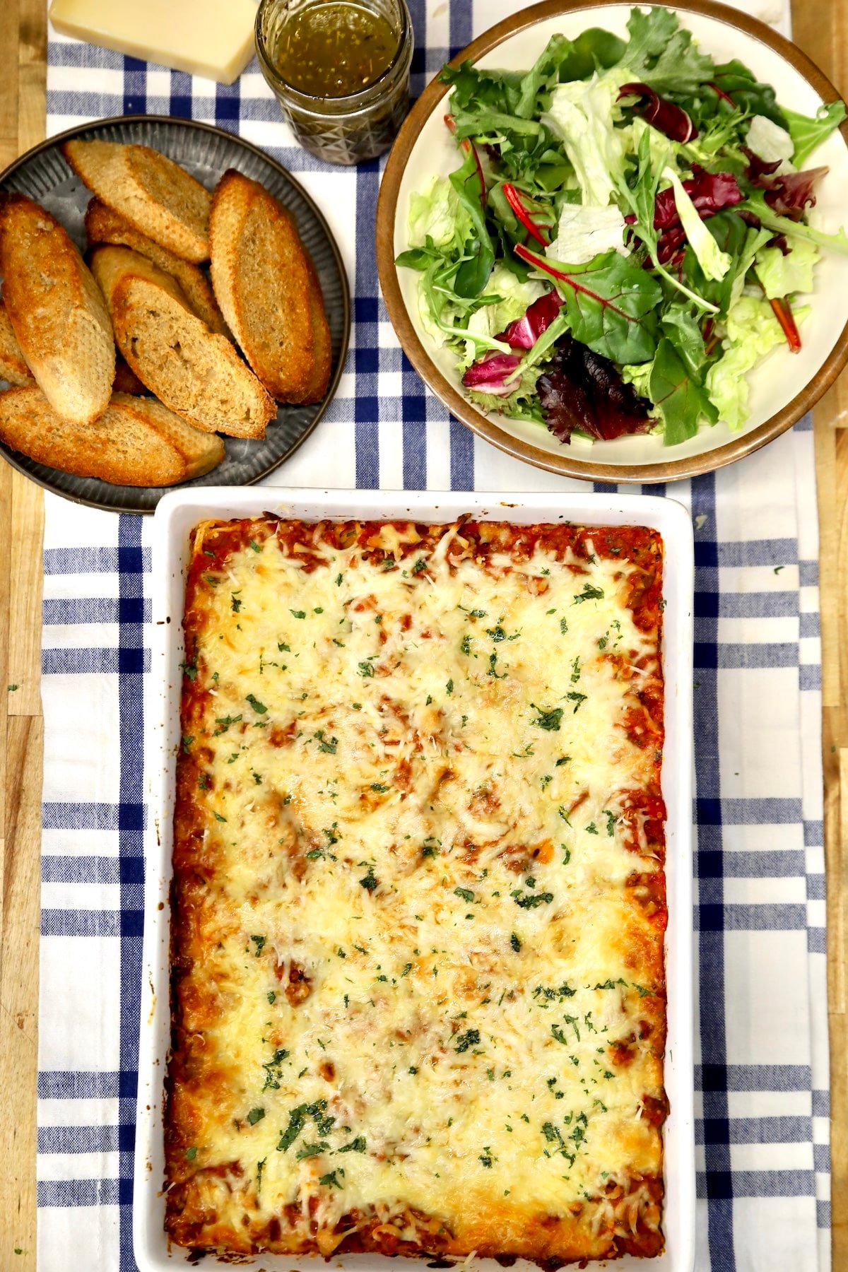 Spaghetti casserole with salad and bread.