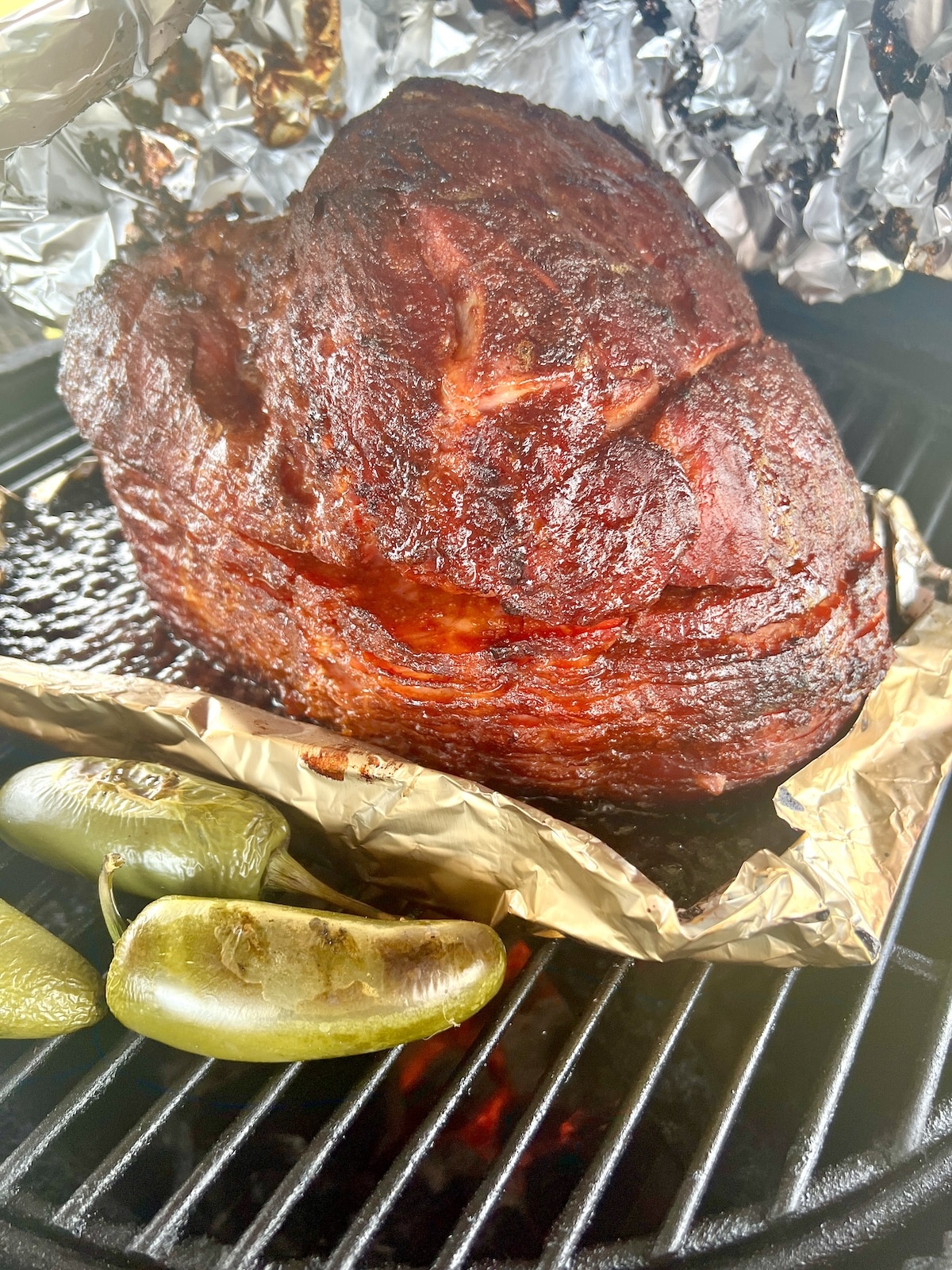 Ham on a grill, jalalpeno peppers.