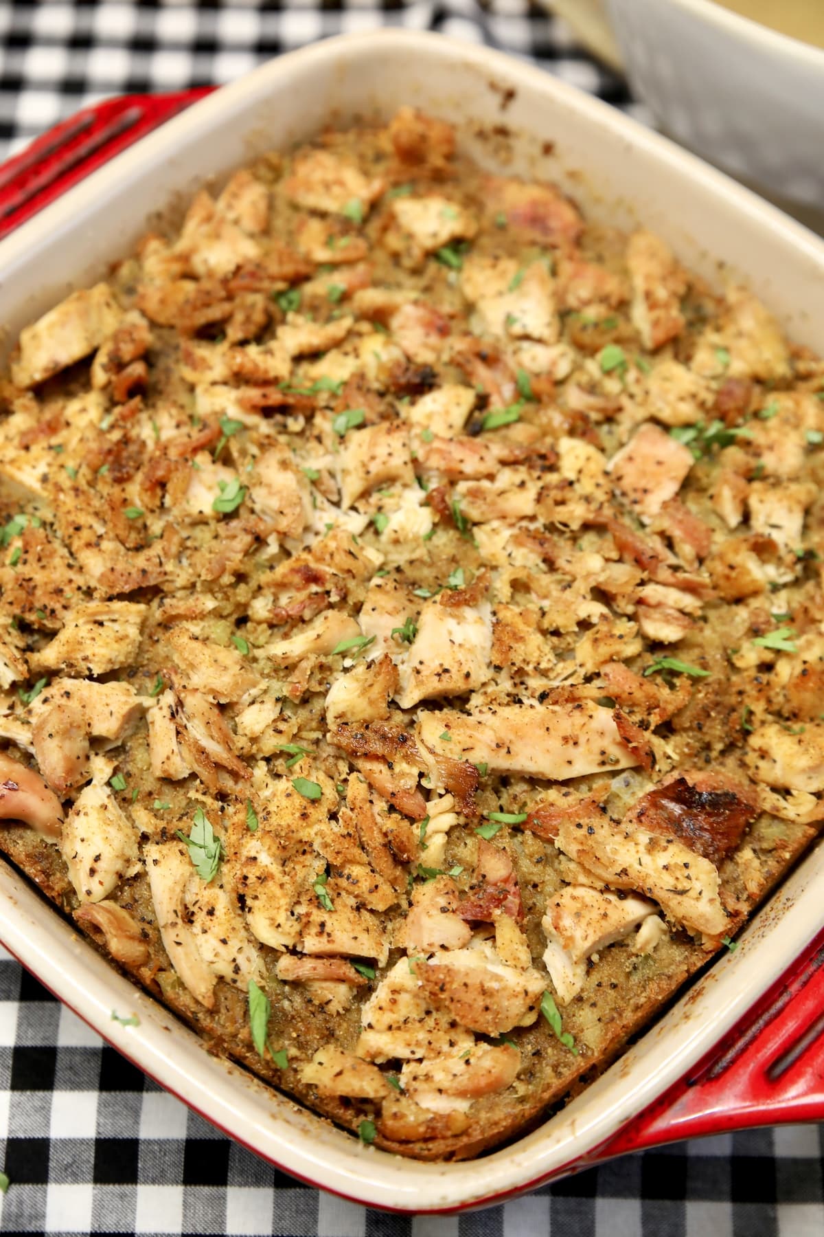 Casserole dish of cornbread dressing casserole.