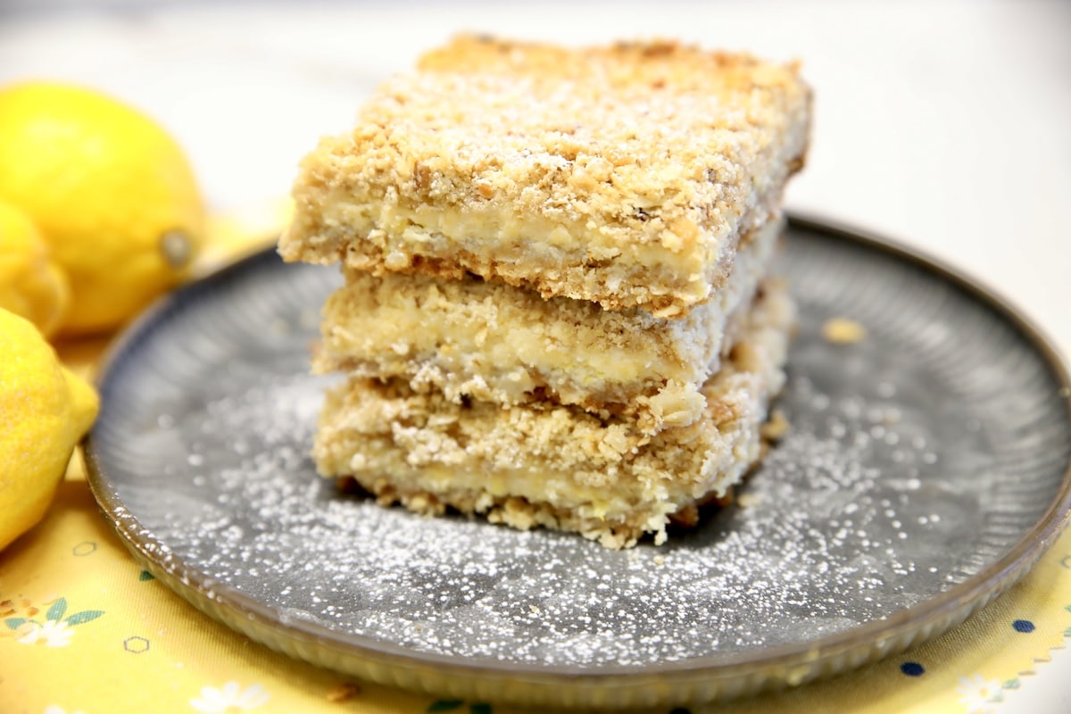 Stack of Lemon dessert bars on a plate.