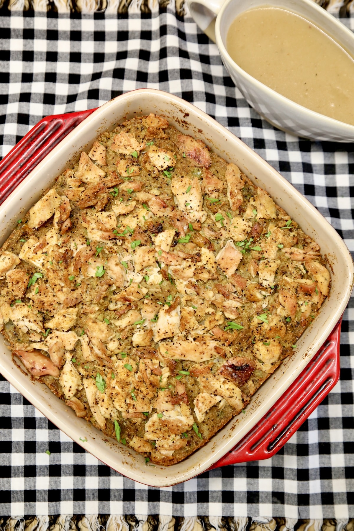Chicken casserole and gravy in boat.