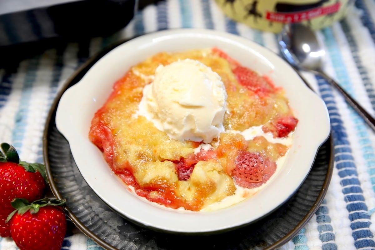 Strawberry pineapple cake. Bowl of strawberry dump cake with vanilla ice cream.