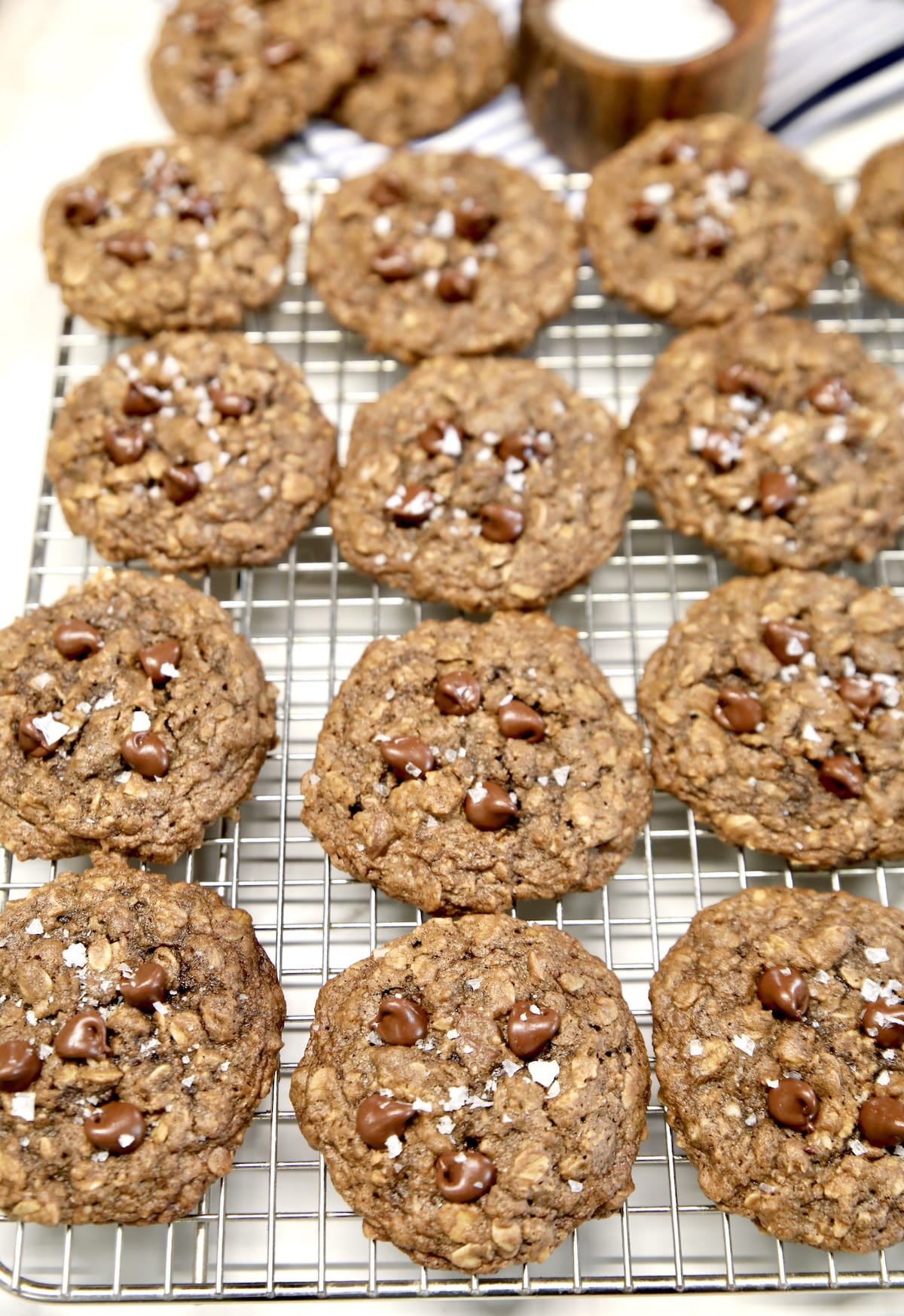 Wire rack with chocolate chip oatmeal cookies.