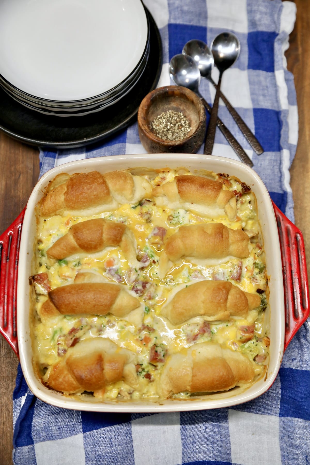 Casserole dish with ham pot pie and crescent roll topping.