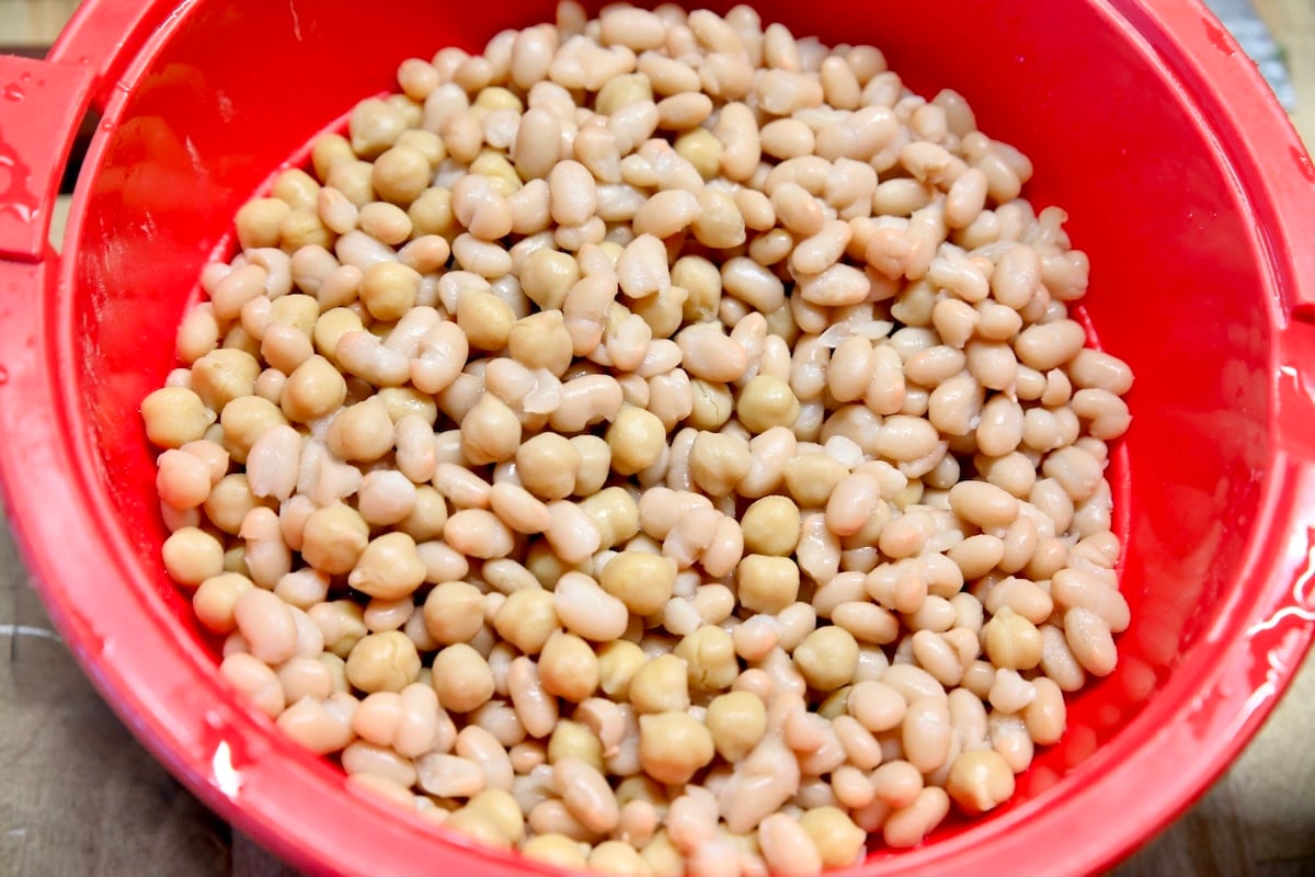 White beans and chickpeas in a colander.