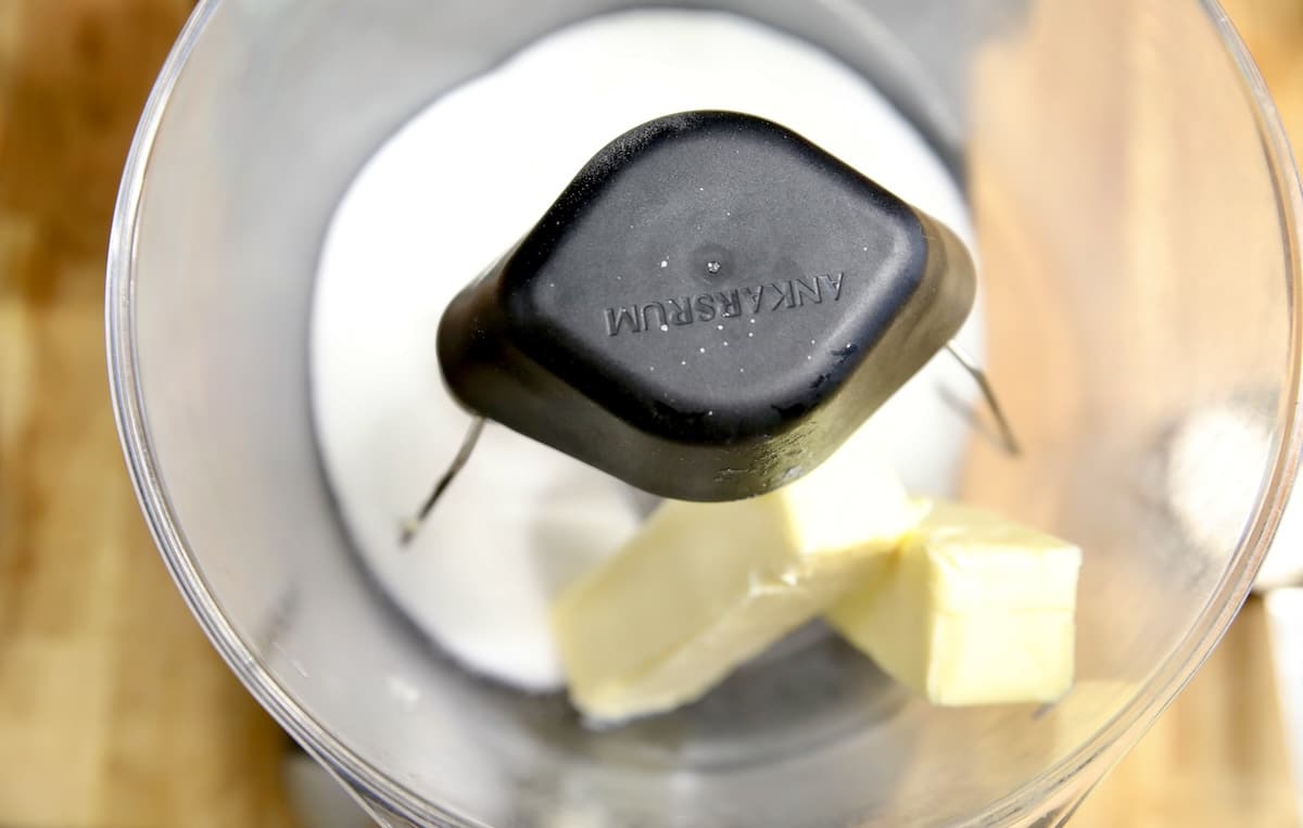 Butter and sugar in a mixer bowl.