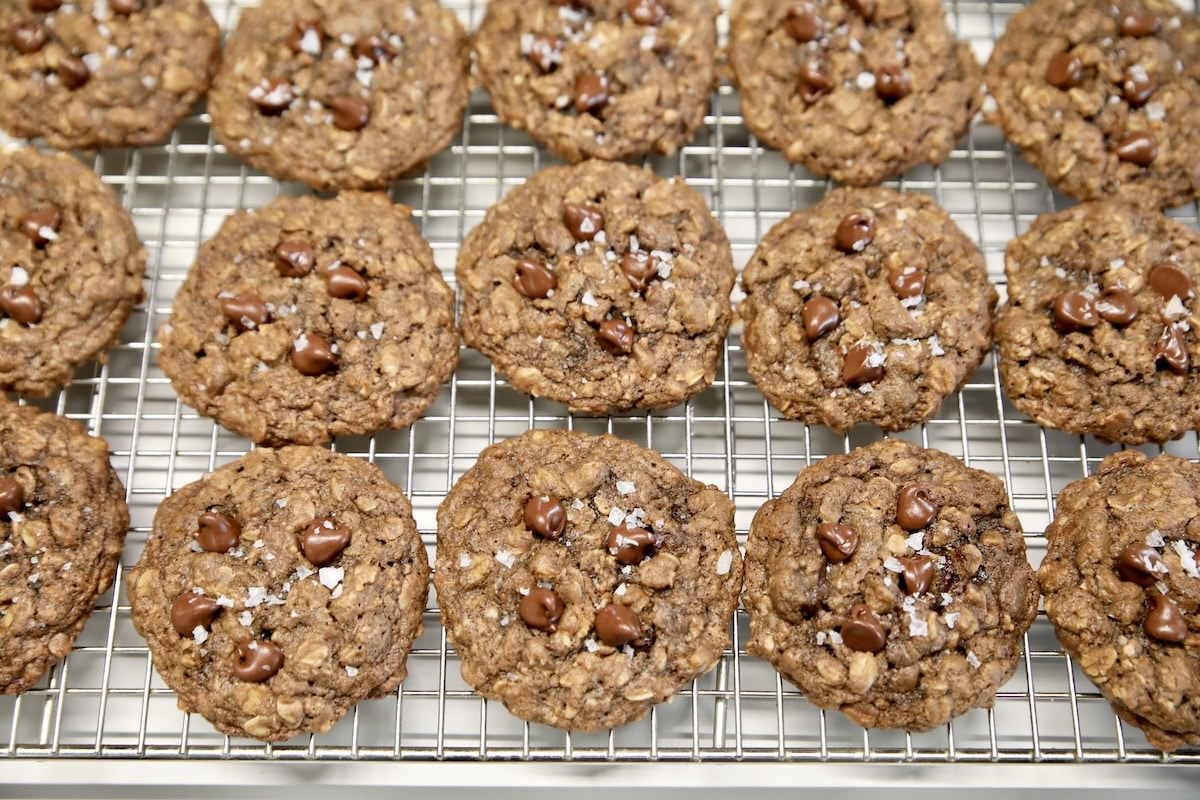 Chocolate cookies on a wire rack.