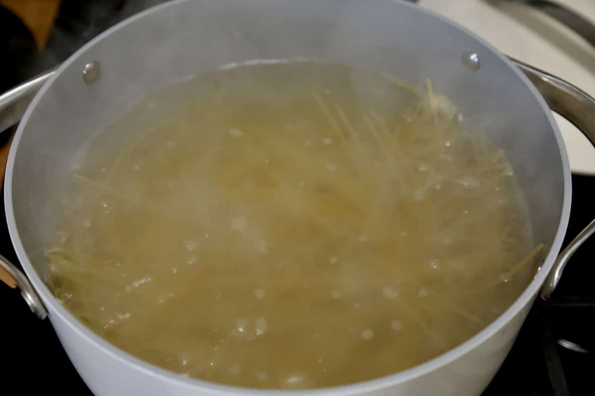 Pan of boiling spaghetti.