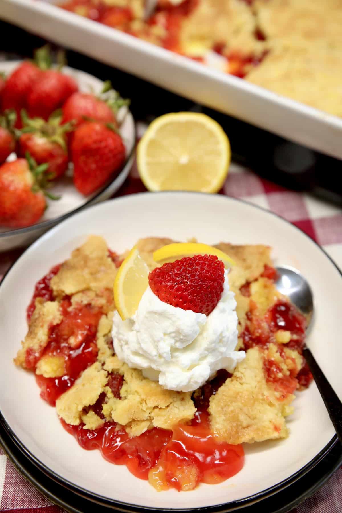 Plate of dump cake with strawberry and lemon filling.