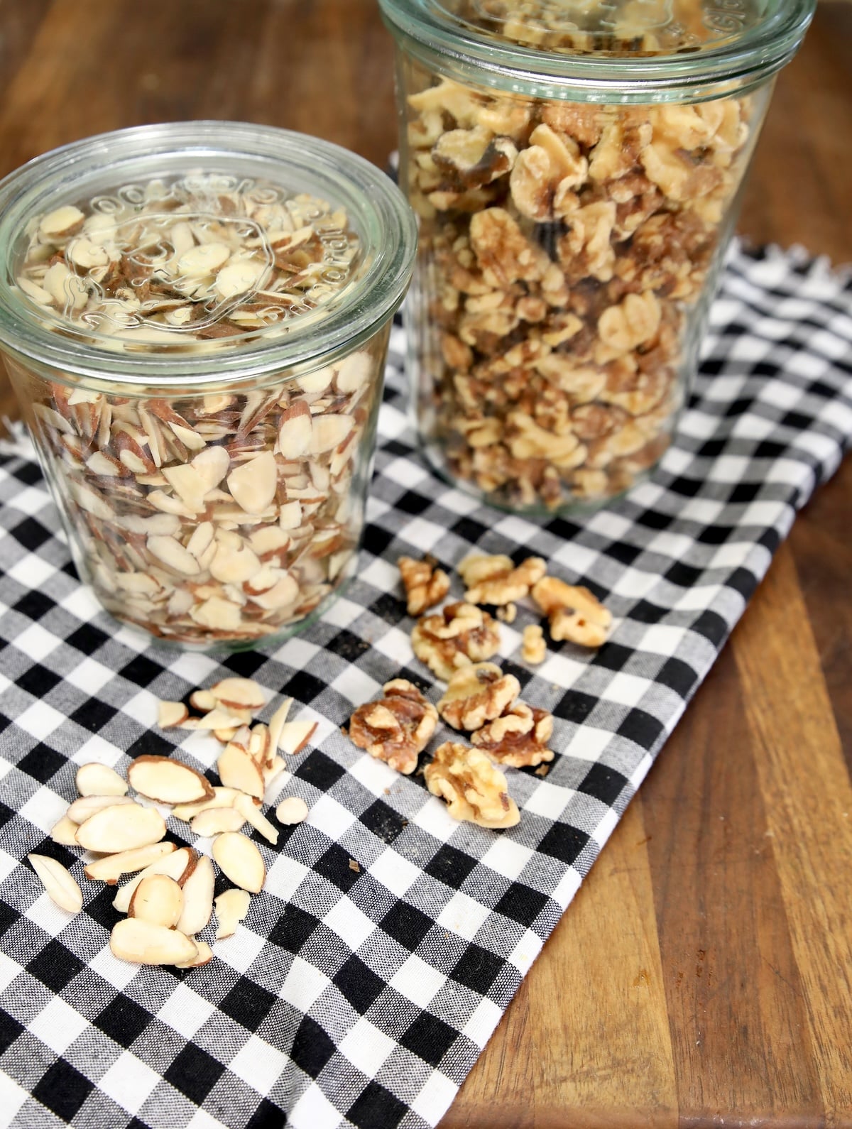 2 weck jars filled with almond slices and walnut halves.