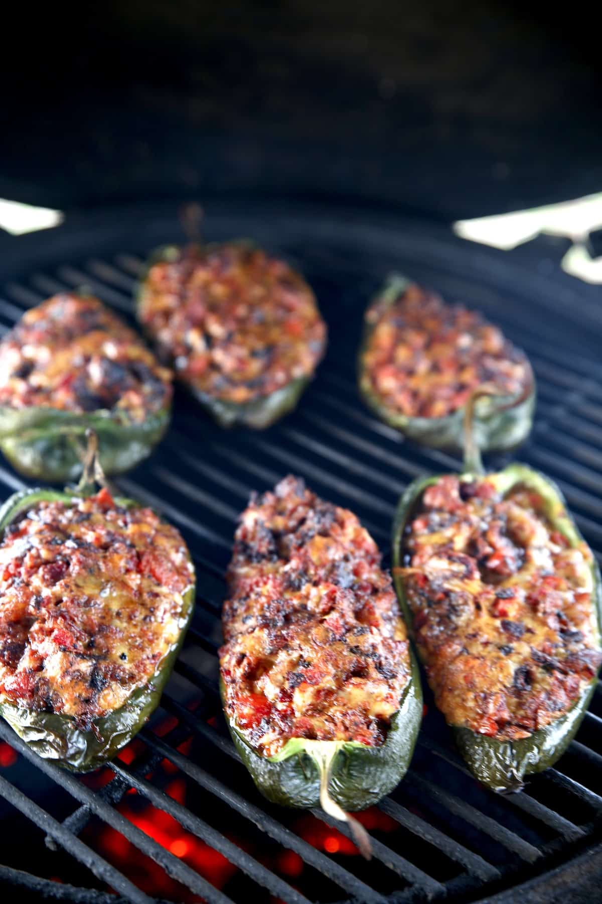 Brisket stuffed poblano peppers on the grill.