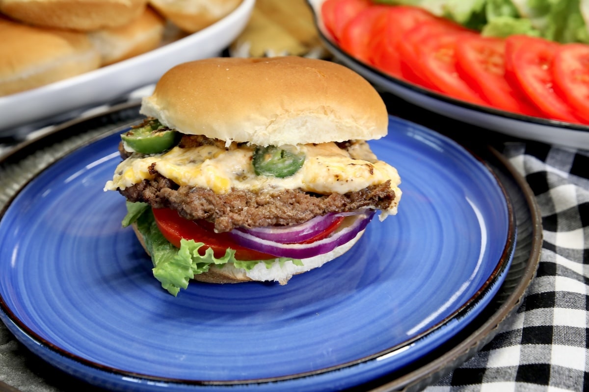 Jalapeno popper burger on a plate.