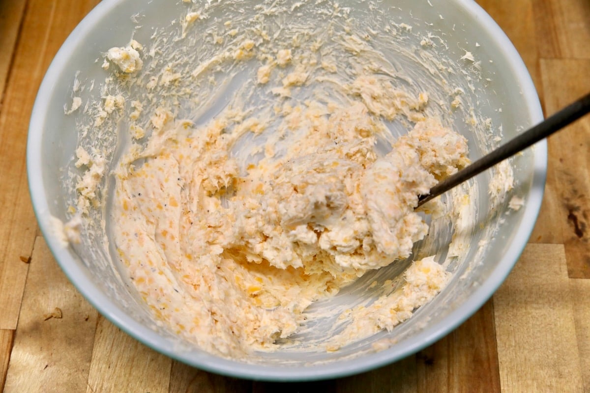 Cream cheese mixture for poppers in a bowl.