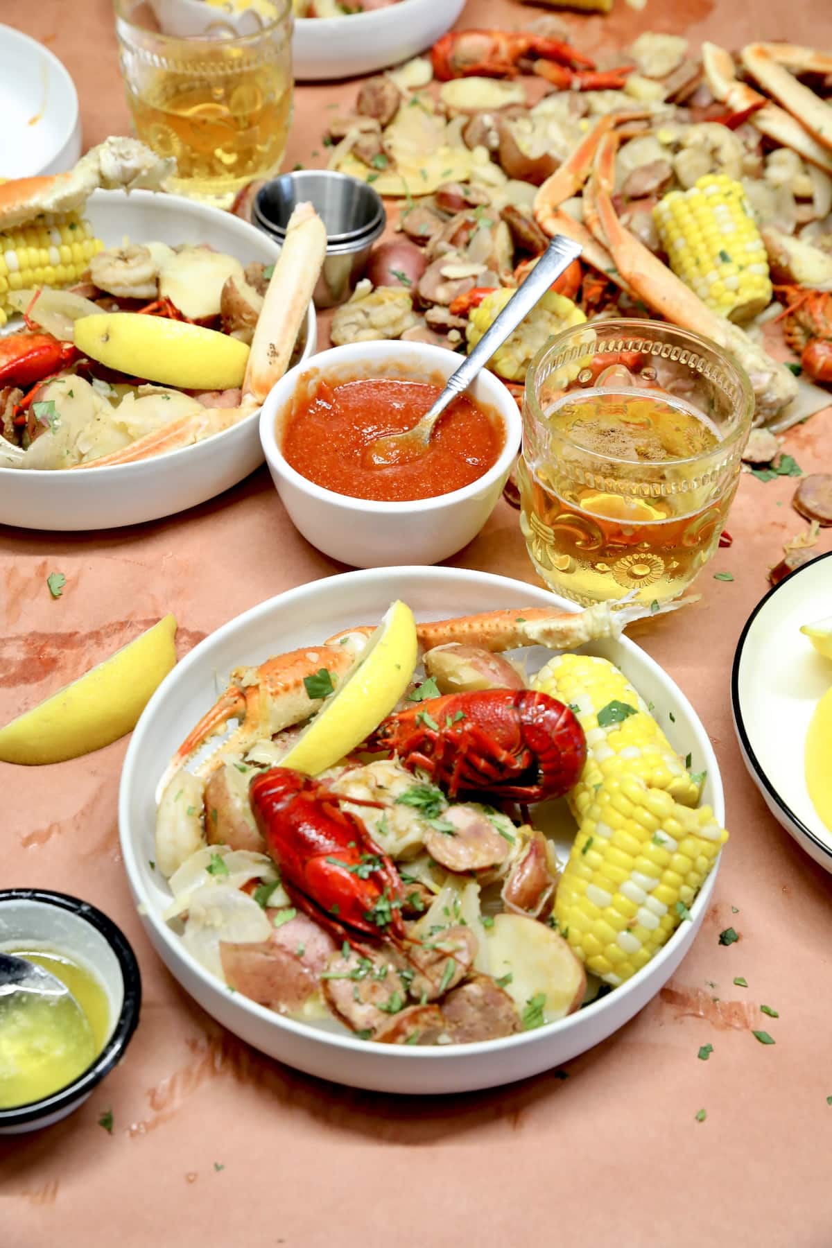 Seafood boil in a bowl with crawfish and crab legs.