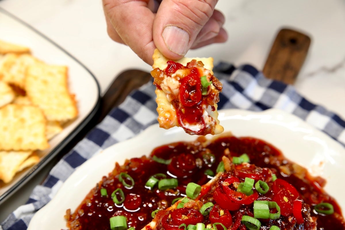 Raspberry chipotle dip on a cracker.