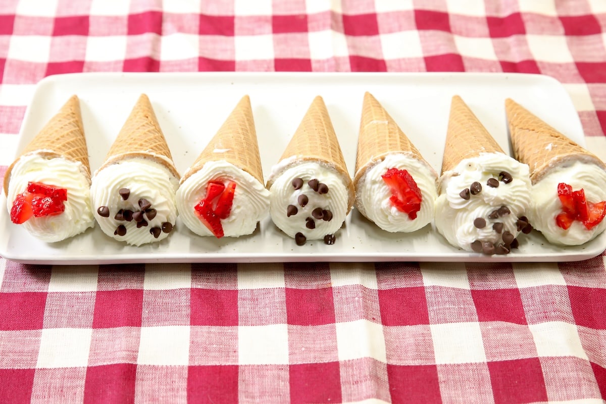 Platter of cheesecake filled sugar cones.