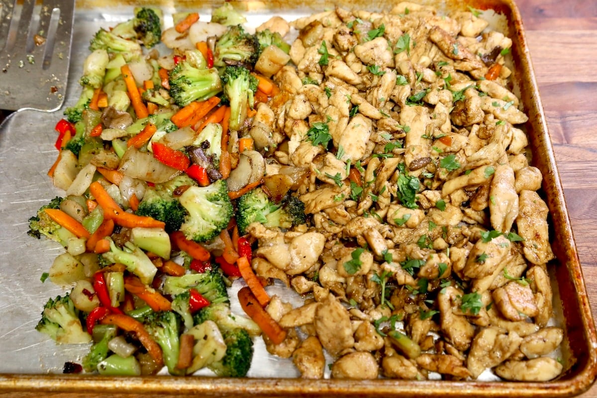 Sheet pan of chicken and vegetable stir fry.
