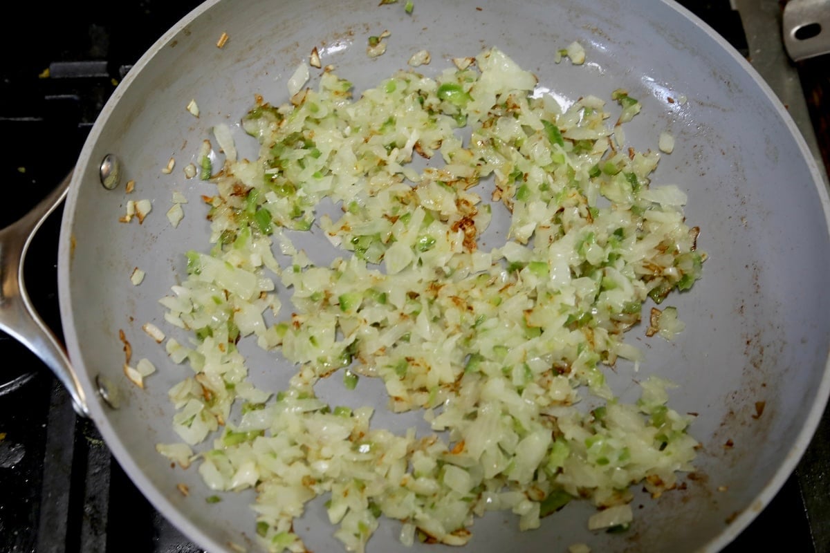 Sauteed vegetables in a pan.