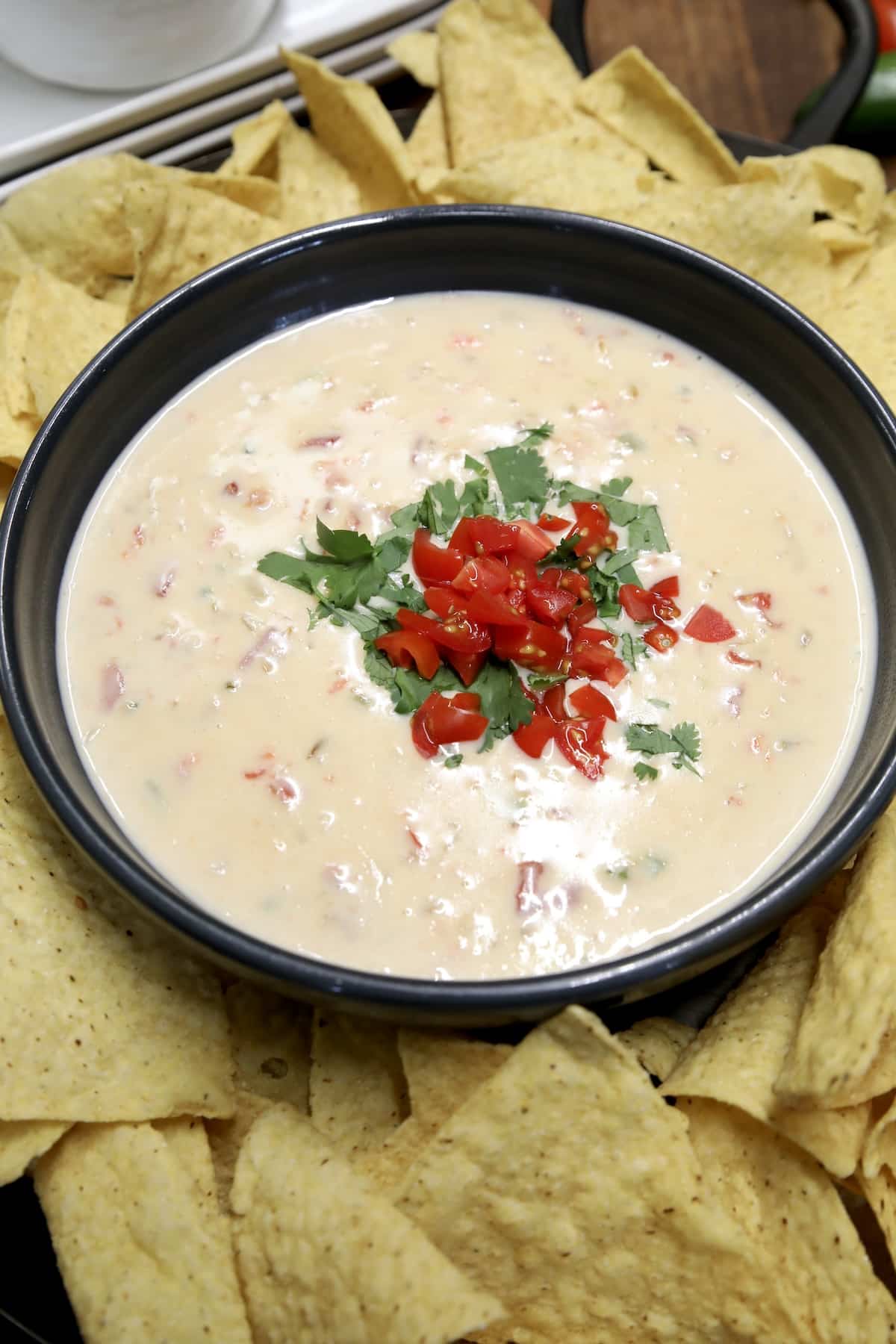 White queso dip with tortilla chips.