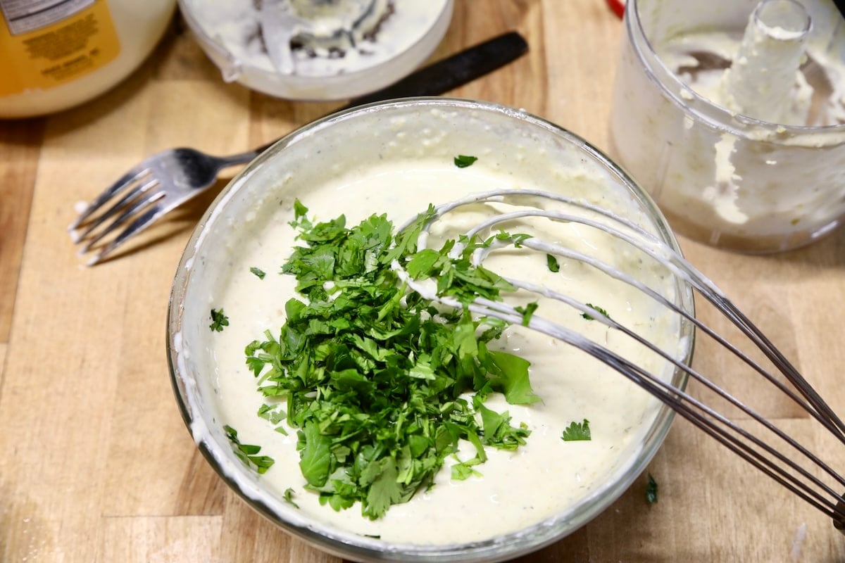 Bowl with jalapeno dip, cilantro.