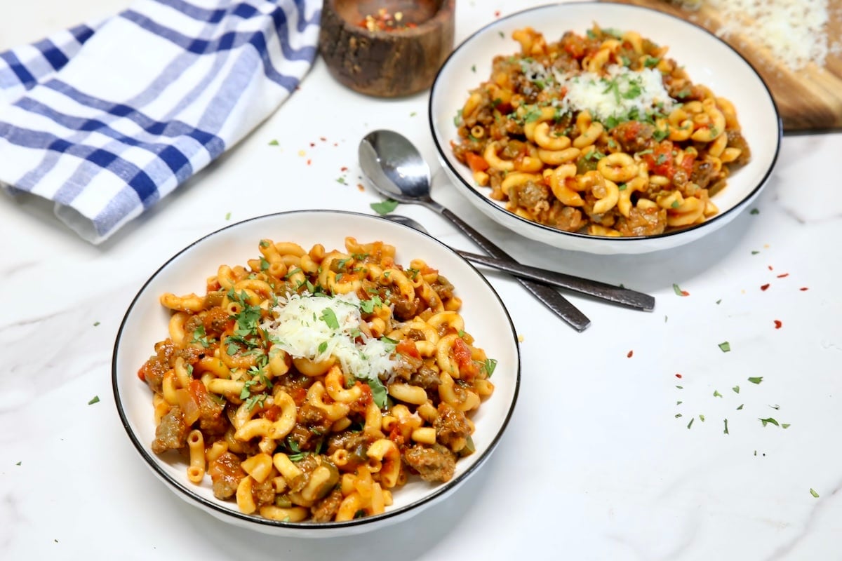 Goulash with sausage and macaroni. Sausage Goulash in 2 bowls.