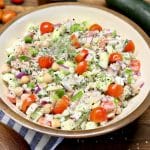 Chickpea salad with cucumbers, tomatoes, creamy dressing.