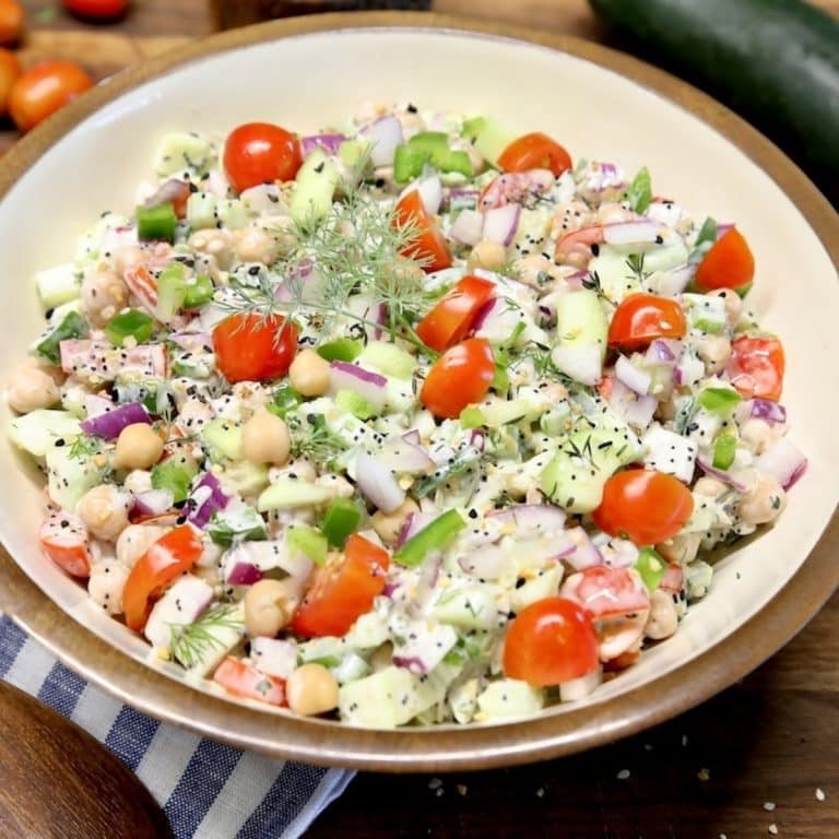 Chickpea salad with cucumbers, tomatoes, creamy dressing.