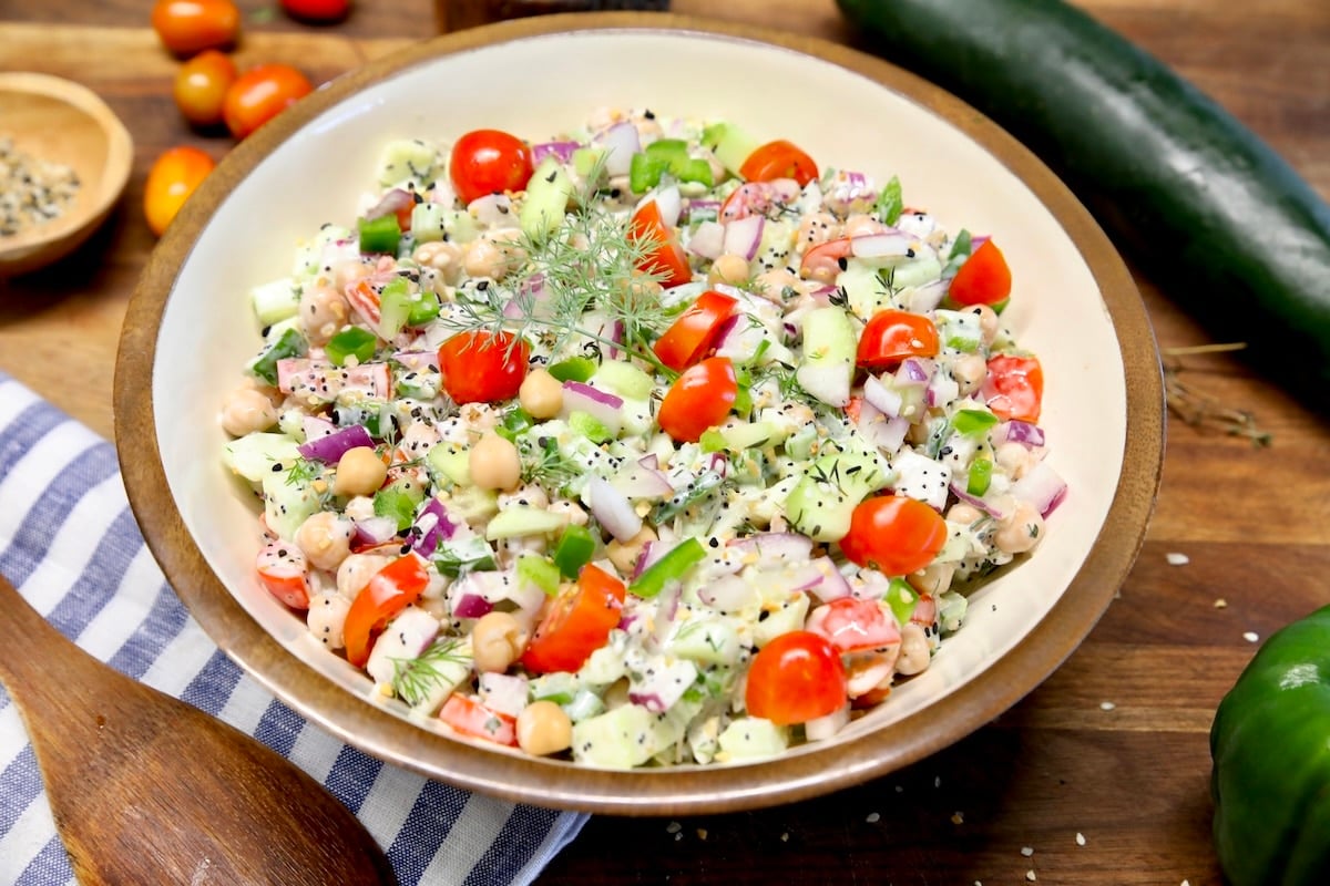 Chickpea cucumber salad with tomatoes in a bowl.