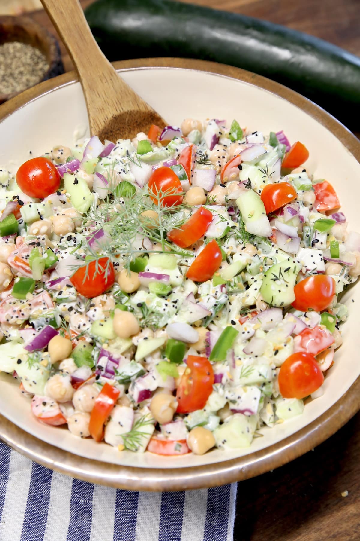 Bowl of cucumbers, tomatoes and chickpea salad.