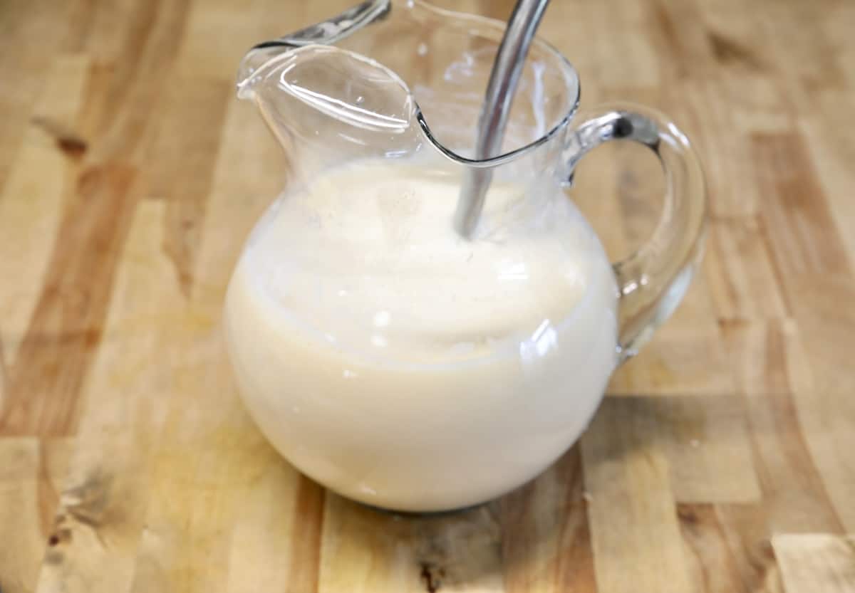 Creamy lemonade in a pitcher.