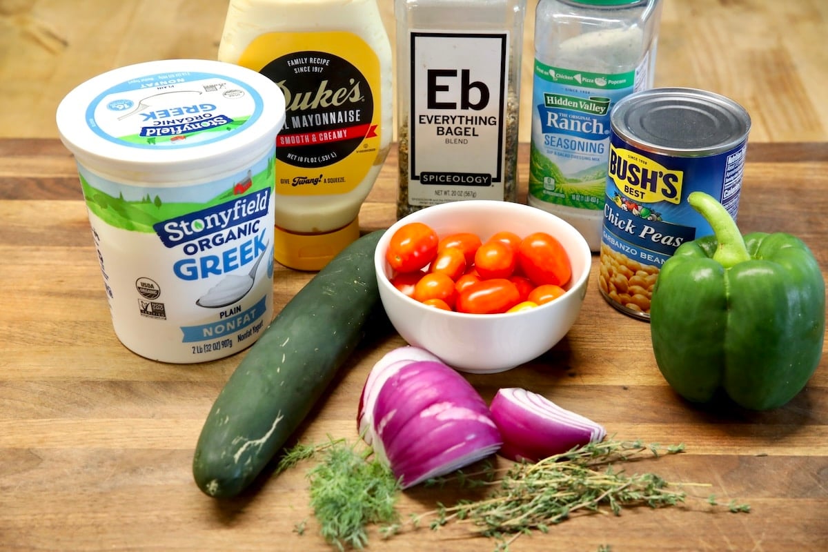 Ingredients for chickpea cucumber salad with creamy dressing.
