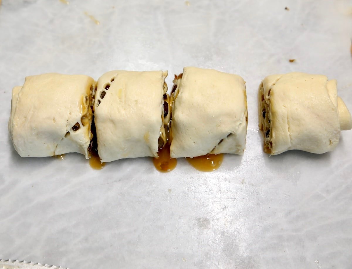 Crescent dough log cut into 4 slices.