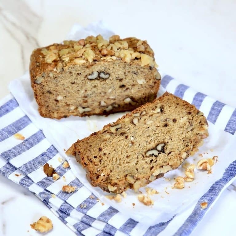 Loaf of banana bread with slice.