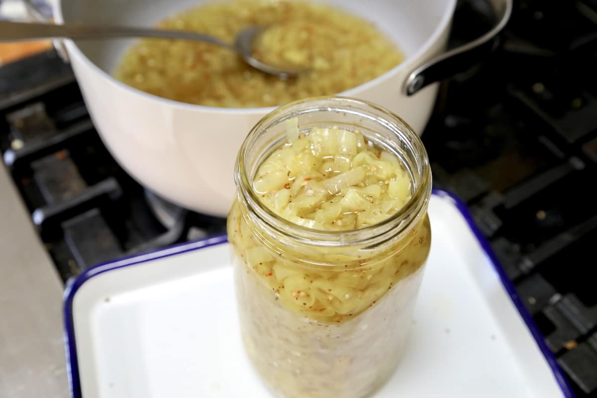 Filling pint jars with banana pepper relish.
