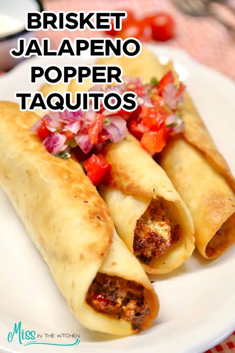 Beef taquitos with cream cheese and jalapeno filling on a plate.