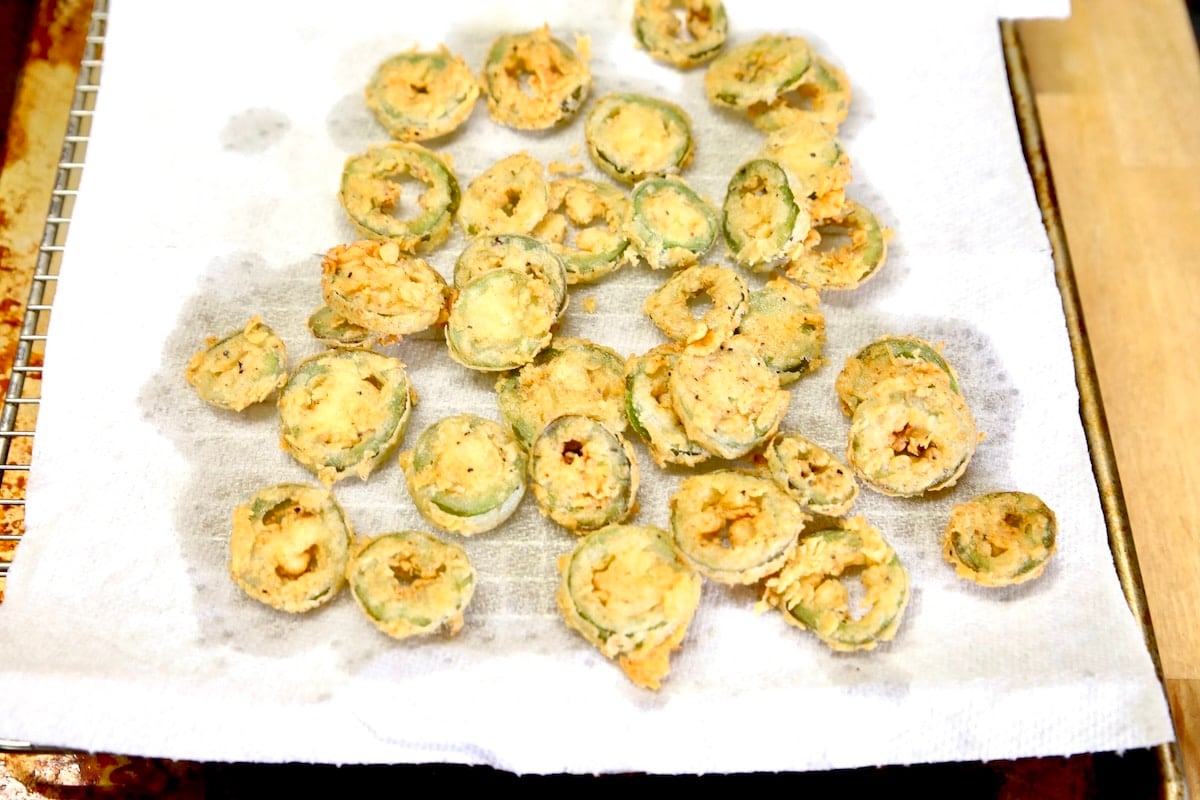 Fried Jalapenos on a paper towel.