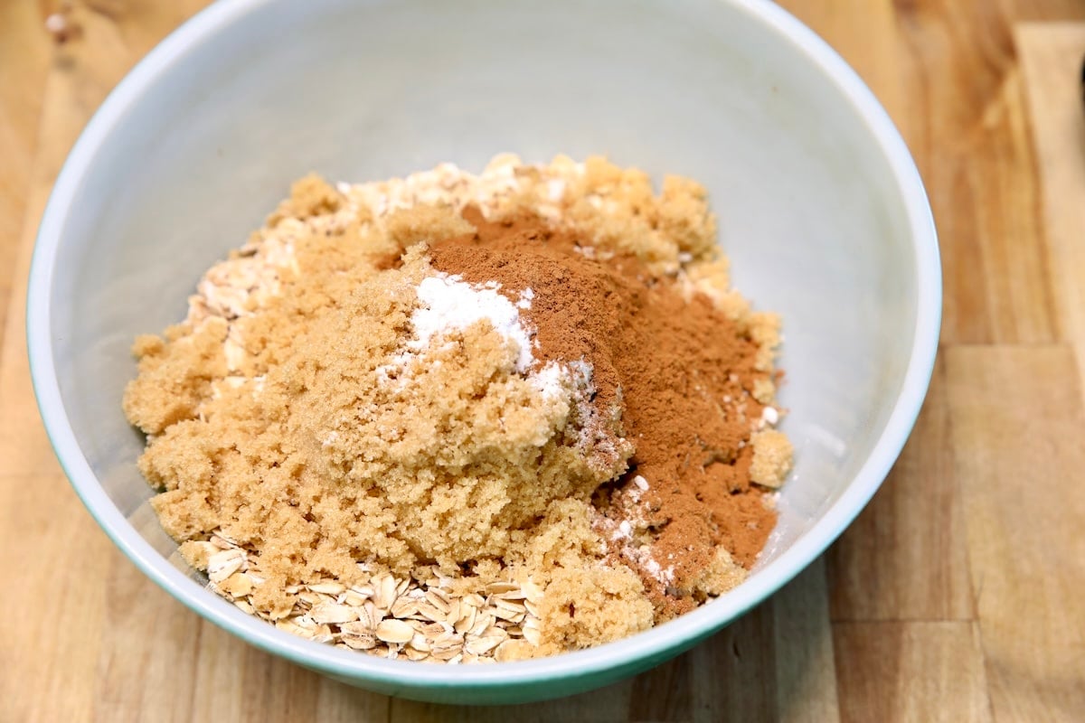 Bowl of oats, flour, brown sugar, cinnamon.
