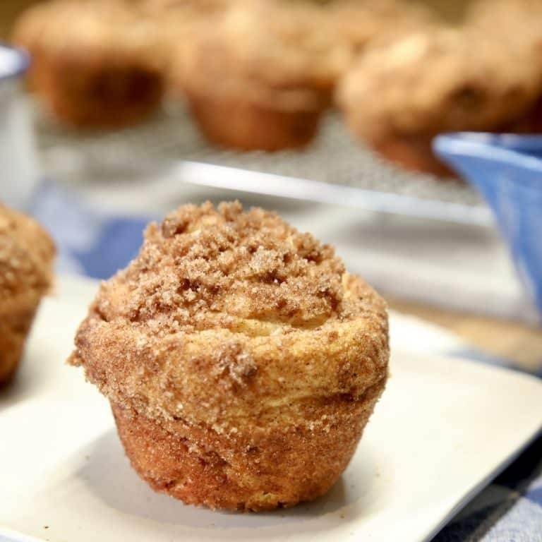 Croissant muffin on a small plate.